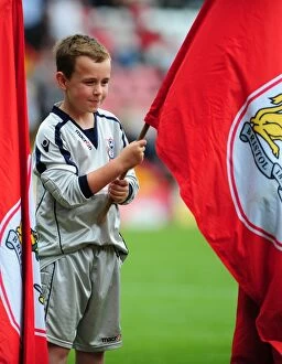 Images Dated 25th August 2012: Bristol City vs. Cardiff City: Flag Bearer at Ashton Gate Stadium, Championship Match - August 25