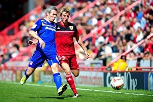 Images Dated 25th August 2012: Bristol City vs. Cardiff City: Intense Moment between Woolford and McNaughton in Championship Clash