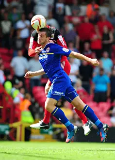 Bristol City vs. Cardiff City: Ryan Taylor Seizes the Ball Over Andrew Taylor