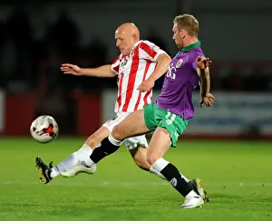 Cheltenham Town V Bristol City Prints: Bristol City vs Cheltenham Town: Intense Moment as Scott Wagstaff Faces Off Against Matt Richards