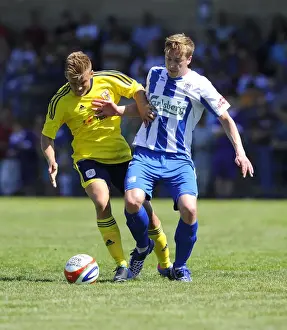 Framed Print : Bristol City vs Clevedon Town: Intense Battle Between Rhys Jordan and Adi Adams