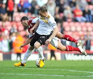 Images Dated 28th September 2013: Bristol City vs Colchester United: McLaughlin Fouled by Wilson