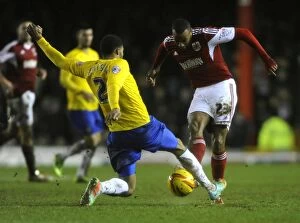 Images Dated 4th February 2014: Bristol City vs Coventry City: Tackle Battle Between Tyrone Barnett and Cyrus Christie