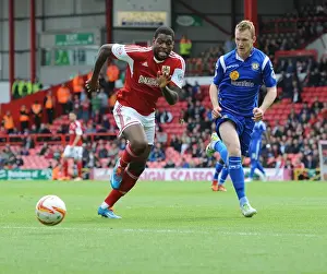 Bristol City vs Crewe: Intense Battle for Possession between Jay Emmanuel-Thomas and Mark Ellis