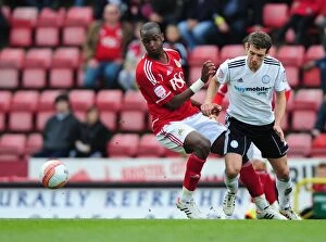 Bristol City v Derby County Collection: Bristol City vs Derby County: Kalifa Cisse Fights for Ball at Ashton Gate Stadium