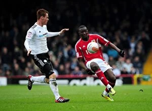 Images Dated 31st March 2012: Bristol City vs Derby County: Yannick Bolasie and Tom Naylor Clash in Intense Football Match at