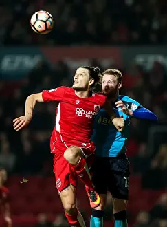 Third Round Prints: Bristol City vs Fleetwood Town: Aerial Battle Between Milan Djuric and Cian Bolger at Ashton Gate Stadium