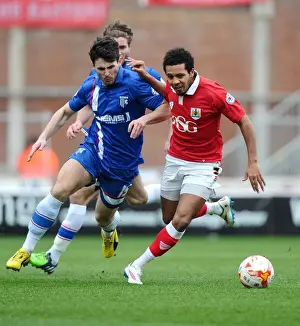 Bristol City vs Gillingham: Intense Battle for the Ball between Korey Smith and Aaron Morris