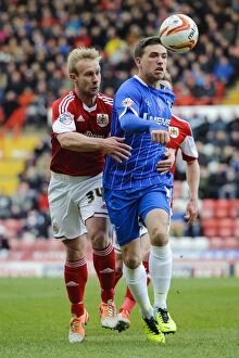 Images Dated 1st March 2014: Bristol City vs Gillingham: Intense Moment as Cody McDonald Clashes with Simon Gillett