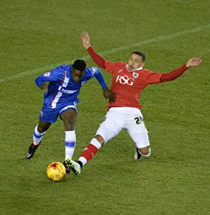 Framed Print : Bristol City vs Gillingham: Tense Moment as James Tavernier Tackles Jermaine McGlashan