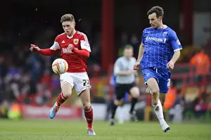 Bristol City V Gillingham Prints: Bristol City vs Gillingham: Wes Burns vs Steven Gregory - Intense Football Clash at Ashton Gate