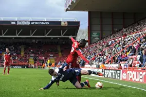 Town Prints: Bristol City vs. Huddersfield: Clash between Albert Adomah and Oliver Norwood in the npower Championship