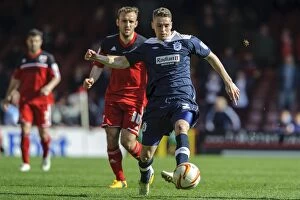 Images Dated 27th April 2013: Bristol City vs. Huddersfield: Intense Moment as Liam Kelly Challenges Calum Woods