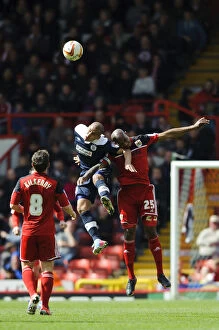 Images Dated 27th April 2013: Bristol City vs. Huddersfield: Marvin Elliott and James Vaughan Battle in the Air during