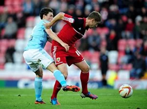 Images Dated 27th October 2012: Bristol City vs Hull City: Derek McInnes and Alex Bruce Clash on the Pitch