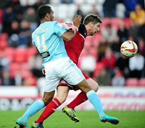 Bristol City vs Hull City: Mark Wilson vs Jay Simpson Battle for Ball in Championship Match, October 2012