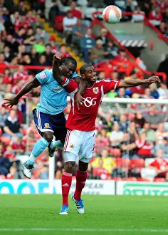Bristol City V Hull City Prints: Bristol City vs Hull City: Marvin Elliott vs Aaron Mclean Battle in Championship Match