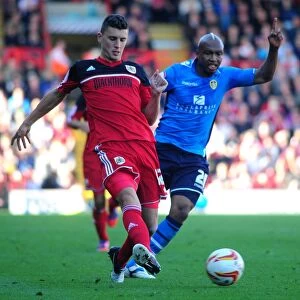 Images Dated 29th September 2012: Bristol City vs Leeds United: Clash Between Wilson and Diouf in Championship Match, September 2012
