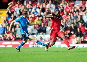 Images Dated 29th September 2012: Bristol City vs Leeds United: George Elokobi Faces Aidan White Challenge in Championship Clash