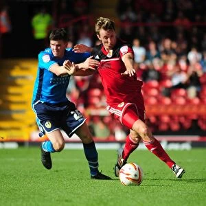 Images Dated 29th September 2012: Bristol City vs Leeds United: Intense Battle for Possession - Martyn Woolford vs Sam Byram