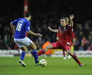 Images Dated 12th January 2013: Bristol City vs Leicester City: Intense Battle for the Ball between Liam Kelly and Matthew James