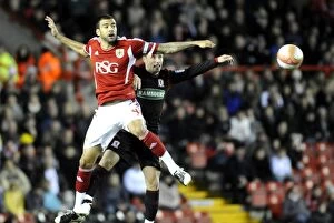 Images Dated 3rd December 2011: Bristol City vs. Middlesbrough: Aerial Clash Between Liam Fontaine and Scott McDonald