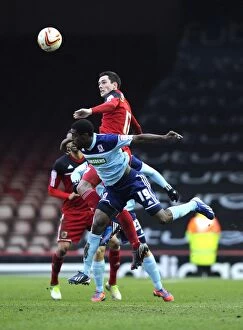 Images Dated 9th March 2013: Bristol City vs Middlesbrough: Intense Aerial Battle Between Greg Cunningham and Mustapha Carayol