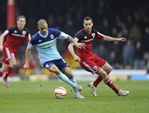 Images Dated 9th March 2013: Bristol City vs Middlesbrough: Kieran Dyer Shields the Ball from Sam Baldock