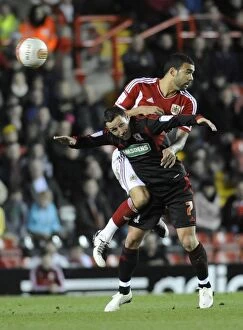 Images Dated 3rd December 2011: Bristol City vs. Middlesbrough: Liam Fontaine vs. Scott McDonald in Aerial Battle - Neil