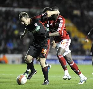 Images Dated 3rd December 2011: Bristol City vs Middlesbrough: Yannick Bolasie Clash with Tony McMahon - Neil Phillips/Pinnacle
