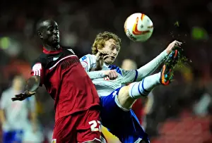 Framed Print : Bristol City vs Millwall: Albert Adomah vs Chris Taylor Battle for High Ball in Championship Match