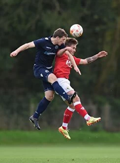 Images Dated 10th November 2014: Bristol City vs Millwall: Intense Aerial Battle between Ben Withey and Keaton Wood