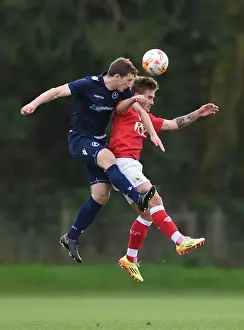 Bristol City U21s Prints: Bristol City vs Millwall: Intense Aerial Battle between Ben Withey and Keaton Wood