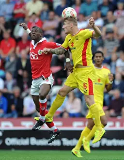 Bristol City vs MK Dons: Intense Aerial Battle Between Kieran Agard and Kyle McFadzean