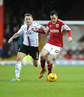 Bristol City vs MK Dons: Intense Battle for Possession between Greg Cunningham and Lee Hodson