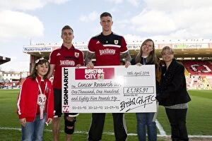 Images Dated 18th April 2014: Bristol City vs Notts County: A Football Showdown with Cancer Research Representative, 2014