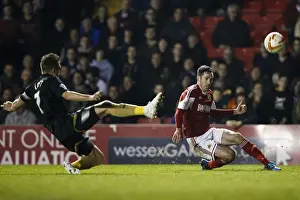 Gate Prints: Bristol City vs Port Vale: Intense Moment as Greg Cunningham Crosses Amidst Doug Loft's Challenge