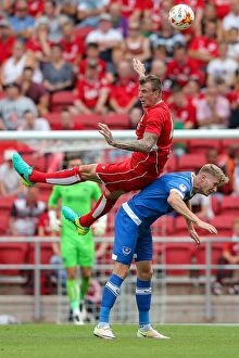 Images Dated 30th July 2016: Bristol City vs Portsmouth: Aden Flint vs Michael Smith Aerial Battle