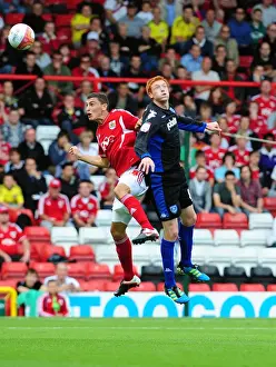 Bristol City V Portsmouth Prints: Bristol City vs Portsmouth: James Wilson vs Dave Kitson Battle for the High Ball - Championship Match