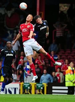 Images Dated 20th August 2011: Bristol City vs Portsmouth: Ryan Taylor vs Greg Halford - Championship Clash at Ashton Gate