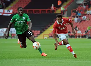 Bristol City vs Scunthorpe United: A Football Rivalry - Intense Moment between Korey Smith and Hakeeb Adelakun