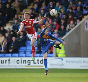 Shrewsbury Town V Bristol City Prints: Bristol City vs Shrewsbury Town: Intense Aerial Battle Between Joe Bryan and Ryan Woods