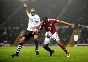 Images Dated 1st February 2011: Bristol City vs Swansea City: Marvin Elliott vs Darren Pratley's Intense Battle in