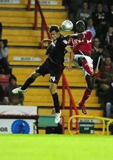 Images Dated 24th August 2011: Bristol City vs Swindon Town: Albert Adomah vs Jonathan Smith Battle in 2011 League Cup Match