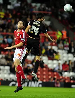 Bristol City V Swindon Town Prints: Bristol City vs Swindon Town: Cole Skuse vs Jonathan Smith Battle in 2011 League Cup Match