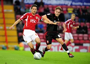Bristol City V Swindon Town Prints: Bristol City vs Swindon Town: Cole Skuse vs Simon Ferry Battle in League Cup Match