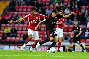 Images Dated 24th August 2011: Bristol City vs Swindon Town: Jordan Spence vs Lander Gabilondo Battle in League Cup Match