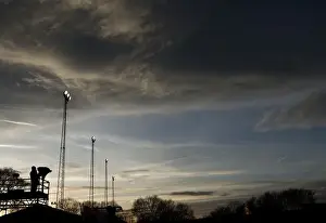 Tamworth V Bristol City Prints: Bristol City vs. Tamworth: Sunset Showdown at The Lamb Ground - ITV Cameraman and Illuminated Floodlights