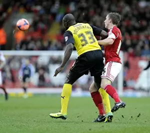 Images Dated 4th January 2014: Bristol City vs. Watford: Intense Moment as Joe Bryan Clashes with Nyron Nosworthy during FA Cup