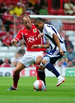 Season 11-12 Prints: Bristol City vs. West Brom: A Battle for the Ball - Louis Carey vs